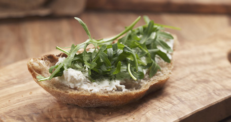 arugula on rustic bread with ricotta cheese, 4k photo