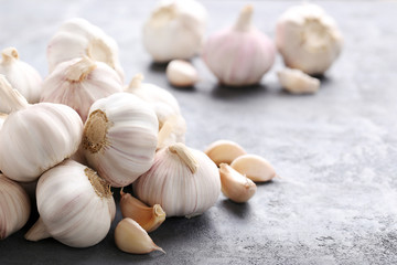 Garlic on the grey wooden table