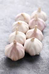 Garlic on the grey wooden table