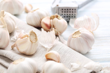 Garlic with napkin on blue wooden table