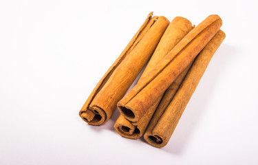 Cinnamon sticks isolated on white background.