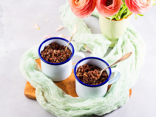 Obraz na płótnie Canvas Red quinoa with vegetables in enamel mugs. Vegetarian gluten free lunch