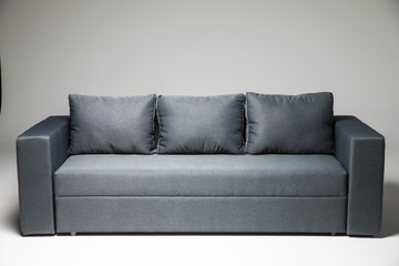 Grey sofa isolated on grey background