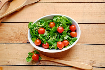 Portion of cherry tomatoes and basil salad.