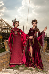Naklejka premium Two sensual ladies in vintage clothes on a boat. Luxury and glamour