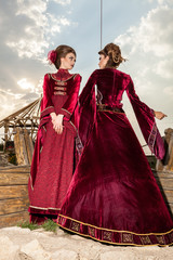 Gorgeous two ladies in vintage clothes on a boat. Luxury and glamour