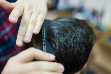 Fototapeta premium Styling of a man's hairstyle