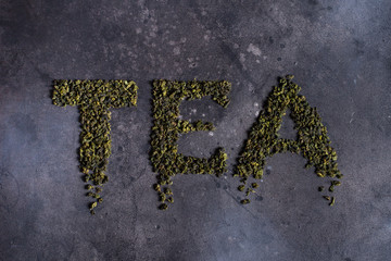 Written tea on a black background.