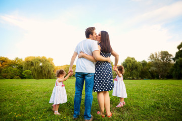 The concept of a happy family. Parents with children