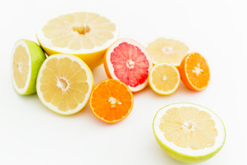 Tropical mix with fresh lemon, orange, mandarin, grapefruit and sweetie on white background. Flat lay, top view.