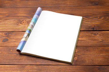 Blank book or magazine cover on wood background