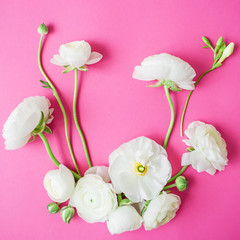 Floral pattern made of white flowers on pink background. Flat lay, top view. Flowers background....