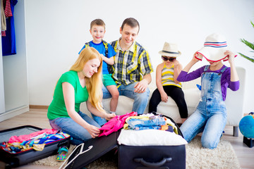 Family packing suitcases