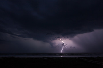 Lightning and the Ocean - Powered by Adobe