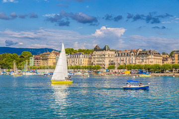 Historic city center of Geneva with boats on Lake Geneva in summer, Switzerland