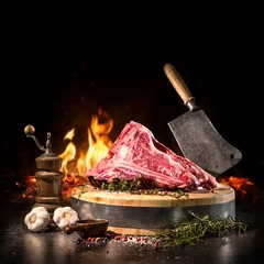 Tuinposter Raw dry aged t-bone steaks for grill © Alexander Raths