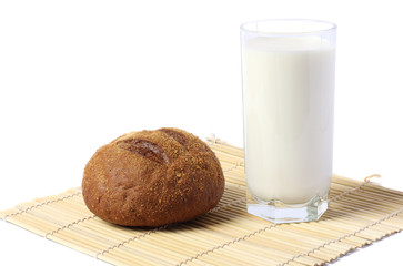 Glass of fresh milk with biscuit isolated on white background