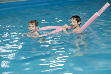 Brothers in swimming pool