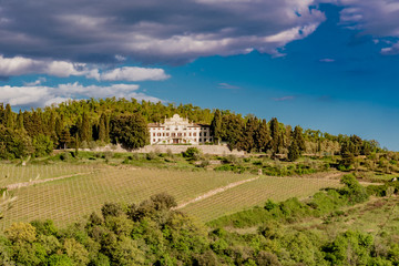 Panorama of green chianti hills in tuscany italy in spring, land of red wine and cypresses
