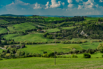 Fototapeta premium Panorama of green chianti hills in tuscany italy in spring, land of red wine and cypresses