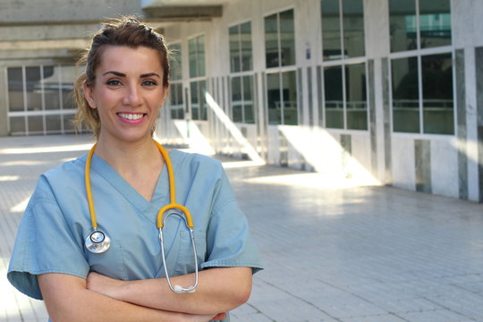 Healthcare professional with arms crossed - Stock image