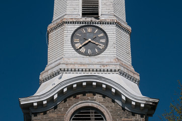 Detail of an aged church clock on the steeple.