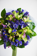 Bouquet of blue irises with Salal and painted willow.Close