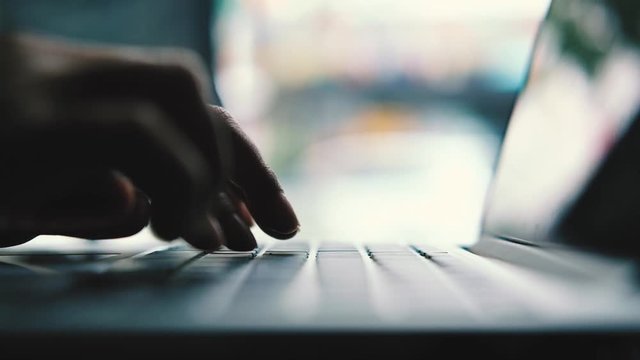 A  business woman's hands working and typing on laptop keyboard 