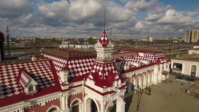 Old original style railway station museum in Yekaterinburg Russia. Trans siberian railway. Aerial drone close forward flight to trains. Day sunny. 2018
