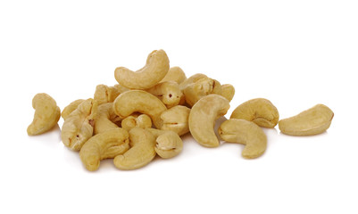 cashew nuts heap with salt on white background