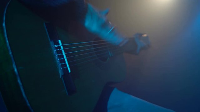 Man playing guitar close-up