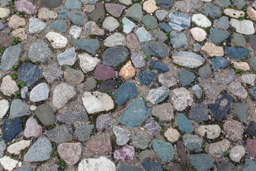 Old road paved with granite stones