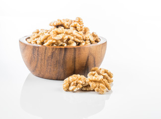 shelled walnuts on a white background