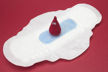 Menstruation sanitary soft pads and tampons for woman hygiene protection and crochet blood drop. Woman critical days, gynecological menstruation cycle. Medical conception photo