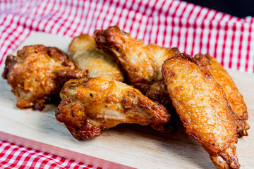 delicious fried chicken wings on table