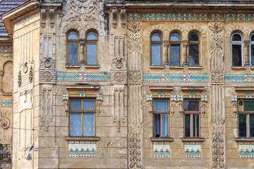 Fototapeta na wymiar Windows on the fasade of the historic building in Lviv city, Ukraine