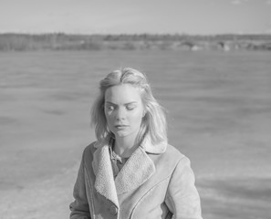 black and white, standing on the ice girl's warm face in the sun.