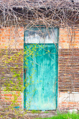 Vintage beautiful old locked wooden door and window with wooden sticks