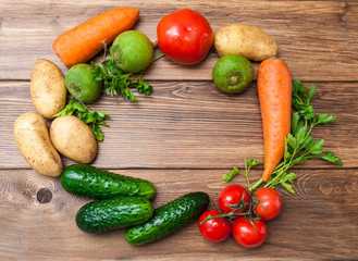 Mix of fresh vegetables on a wooden table. The concept of a healthy diet