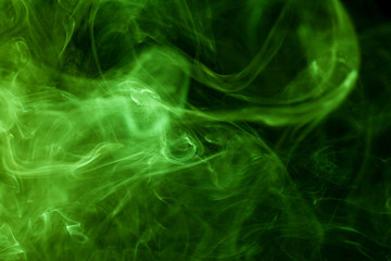 Green smoke movement on black background.