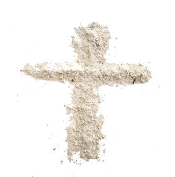 christian cross made in grey ash or dust as grave