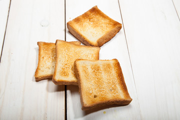 Toast bread on a white wooden background