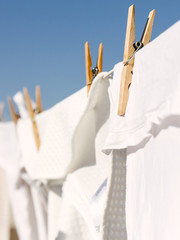 White clothes hung out to dry in the bright warm sun
