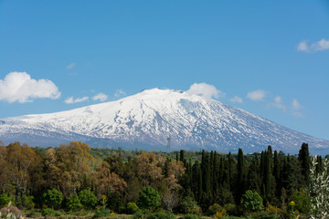 snow on mountain etna, big italian volcano, seen from the plain