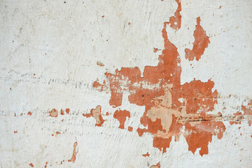 Damaged plaster with cracks. Orange and white wall in Bangalore, Karnataka, India. Textures and backgrounds. 