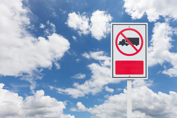 No truck allowed sign on blue sky background.