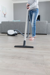 Attractive Female with Vacuum Cleaner