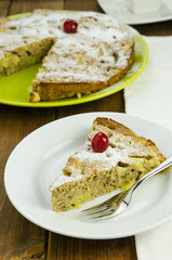 Slice of apple pie on white plate