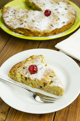 Slice of apple pie on white plate