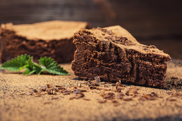 chocolate cake with Candies and cup of coffee,Chocolate cake with a cut piece and blade on gray background, closeup,Dark chocolate cake,Delicious vegan chocolate cake,Tasty chocolate cake 